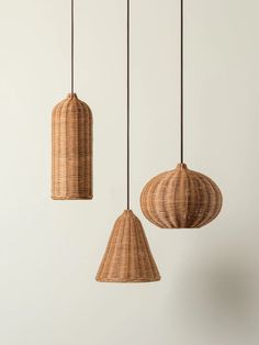 three wicker lamps hanging from the ceiling