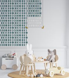 a child's play room with toys and wallpaper on the walls, including an elephant toy