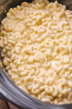 macaroni and cheese is being cooked in the slow cooker