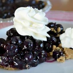 blueberry pie with whipped cream on top