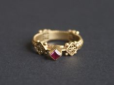 Ornate Gold Ruby Ring, Traditional Ceremonial Ruby Rings, Traditional Ruby Rings For Ceremonial Occasions, Ornate Gold Ring With Ruby, Ornate Gold Rings With Ruby, Medieval Jewelry With Historical Design As Gift, Medieval Style Jewelry With Historical Design, Medieval Jewelry With Historical Design For Gift, Ceremonial Ruby Ring Jewelry