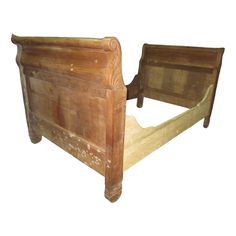 an old wooden bed frame with no headboard and foot board on the bottom side