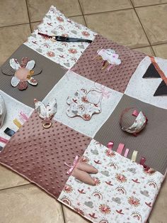 a patchwork table cloth is laid out on the floor