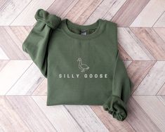 This soft and cozy Silly Goose Sweatshirt is bound to keep you warm in the colder months. The perfect birthday gift or aesthetic crewneck to add to your wardrobe! Please note that the design is EMBROIDERED. Please note that due to variations in monitors & lighting the colors of the fabric and design may look slightly different in real life. DETAILS * Air-jet spun yarn with a soft feel and reduced pilling * Double-needle stitched throughout * 50% cotton, 50% polyester * Printed and shipped from t Chic Sweatshirt, Doctor Gift, Color Crafts, Look Plus, Human Resources, Cut And Style, Dog Mom, Sweat Shirt, Bulldog