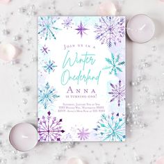 a winter wonderland birthday party with candles and snowflakes