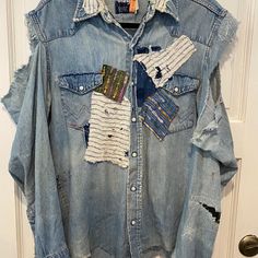 Vtg Wrangler Reimagined Pearl Snap Distress Faded Denim Blue Jean Shirt Patchwork Size Tag Has Faded, Please See Measurements For Fit. Vintage Shirt Up Cycled With Patchwork, Stitching, & Distressing. One Of A Kind Shirt. Item Is Pre Owned And In Good Condition. Measurements Are Done With Item Laying Flat And Are For Your Fit Reference. Please See Pictures For Details. Armpit To Armpit: 21 Inches Armpit To Hem: 17 Inches Back Collar To Hem: 28 Inches Patchwork Stitching, Shirt Patchwork, Blue Shirt With Jeans, Fit Reference, Jean Shirt, Upcycled Denim, Faded Denim, Denim Patchwork, Vintage Shirt