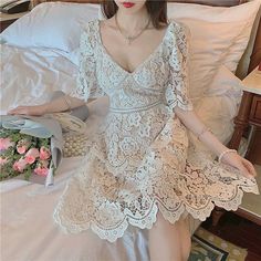 Elegant Floral Embroidery Lace Hollow Out High Waist Holiday Dress | Uniqistic.com Summer V-neck Lace Dress, White V-neck Lace Dress With Lace Trim, Feminine V-neck Lace Dress With Lace Trim, Feminine Lace V-neck Mini Dress, V-neck Lace Patchwork Mini Dress For Wedding, Feminine V-neck Mini Dress With Lace Patchwork, V-neck Mini Dress With Lace Patchwork For Wedding, V-neck Mini Dress With Lace Trim, Feminine Fitted V-neck Lace Dress