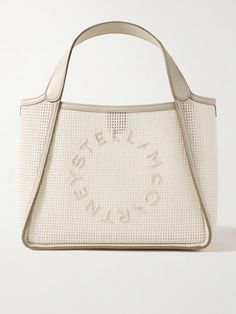 Stella McCartney's tote is hand-crocheted from cotton and reinforced with vegan leather trims and structured mesh lining. It's appliquéd with the label's circular logo and comes with an optional shoulder strap and interior pouch to keep small items close at hand. There's plenty of space for your phone, sunglasses, wallet and planner. Circular Logo, Stella Mccartney Bag, Cotton Totes, Small Items, Leather Top, Body Bag, Fashion Bracelets, Fashion Watches, Leather Trims