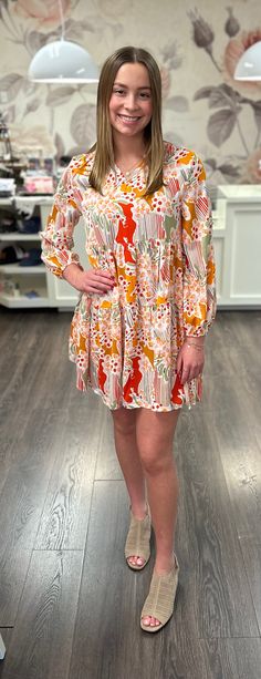 Let your style take on an abstract vibe in this oh-so-chic 3/4 sleeve dress. Crafted with a vibrant mix of cream, orange, sage, red, tan and black, this A-line beauty is perfect for any occasion! So scoop it up and give your wardrobe that something extra! 100% Polyester Bohemian V-neck Mini Dress With Vibrant Print, Spring Mini Dress With Abstract Print And V-neck, Puff Sleeve Dress, Children's Boutique, Puffed Sleeves Dress, Pet Hair, Xl Dress, Sleeve Dress, Puff Sleeve