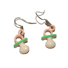 two pairs of earrings with green and white beads on them, one has a pink earring