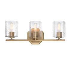 three light bathroom fixture with clear glass shades on the top and bottom half of it