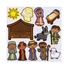 a bunch of stickers that are on top of a white sheet with an image of the nativity scene