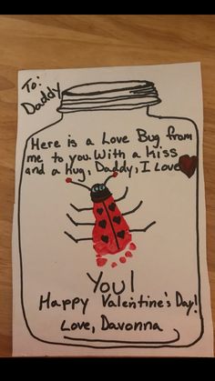 a handmade valentine's day card with a ladybug in a jar