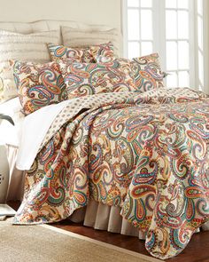 the comforter is neatly made and ready for someone to use it in their home