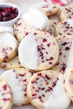 cranberry shortbread cookies with white frosting on a plate