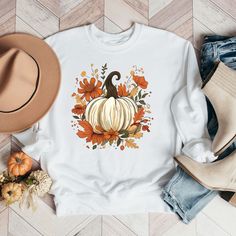 Looking for a cute versatile top to wear this summer? Make sure to grab one of our Fall Pumpkin Floral Sweatshirts! This soft and comfortable shirt is the perfect top for any outfit. It can be paired with biker shorts, Jeans, or the classic stay at home sweats! The bright color adds a pop of summer to any outfit. This sweatshirt is true-to-size, so be sure to order your regular size! If you are looking for a more oversized look, make sure to size up. Red H, Floral Sweatshirt, Color Dust, Gildan Sweatshirts, Fall Sweatshirt, Shorts Jeans, Blue Ink, Carolina Blue, White Ink