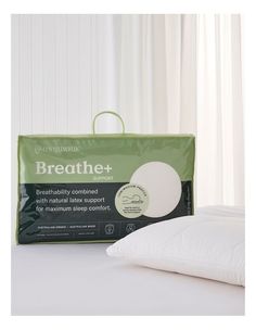 two pillows sitting next to each other on top of a white bed with the words breather