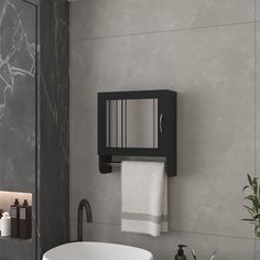 a white sink sitting under a mirror next to a wall mounted faucet in a bathroom