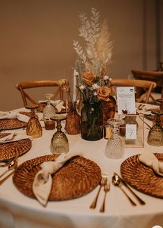 the table is set with place settings for dinner