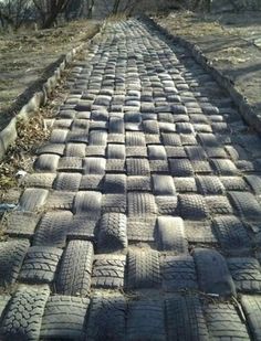 an old brick road made out of tires