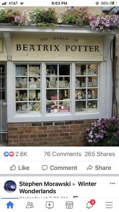 an image of a storefront with flowers on the window and in front of it