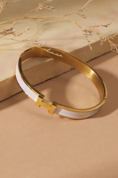 Bracelets for Women | Charm Bracelets | Altar'd State Delicate Gold Chain, Hermes Bracelet, Preppy Jewelry, Clover Bracelet, Cuff Bangle Bracelet, Gold Bracelet For Women, Gold Cuffs, Jewelry Lookbook, Gold Bangle