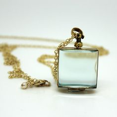 Brass and silver locket chains are available in labradorite, freshwater pearls,14kt gold-filled, and sterling silver. The glass is encased in brass or sterling silver. The round pendant is 25 mm in diameter; the square pendant is 23 mm across Available in lengths 26 and 34 inches (Note: the labradorite and pearl chains do not have a clasp, they slip right over the head - if you would like one just let me know and I'll put one on at no extra cost) Starting at $123.99 The glass locket necklace has Clear Vintage Jewelry For Gifts, Antique Glass Necklace For Gift, Antique Glass Jewelry As Gift, Antique Glass Jewelry For Gifts, Elegant Glass Jewelry For Keepsakes, Vintage Glass Necklace Nickel Free, Vintage Glass Nickel-free Necklace, Vintage Nickel-free Glass Necklace, Elegant Glass Necklace For Keepsake