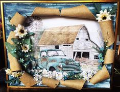 an old blue truck with flowers on the front and side is framed by burlap