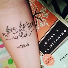 two tattoos with words written on them, one has a tree and the other is a bird