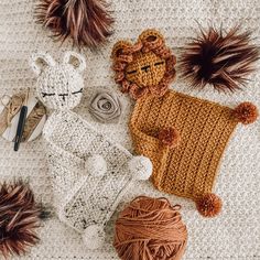 several crocheted items are laid out on the floor