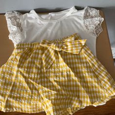 This Super Cute Checkered Short Set With A Laced Top Is Perfect To Be Dressed Up Or Down. Yellow Summer Tops For School, Yellow Tops For School In Summer, Yellow Summer Top For School, Red Checkered Shorts Outfit, Yellow Gingham Outfit, Easter Outfit Women, Trendy Gingham High-waisted Shorts, Lucky Brand Outfits, Baby Checkered Dress