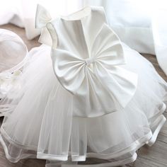 Summer Princess Dress With Bow For Birthday, Elegant Summer Princess Dress For Birthday, Sleeveless Princess Dress With Bow For Birthday, Sleeveless Dress With Bow For Birthday, Spring Princess Dress With Bow For Dress-up, White Bow Dress For First Birthday, White Dress With Bow For First Birthday, White Bow Dress For Birthday, White Sleeveless Princess Dress For Birthday