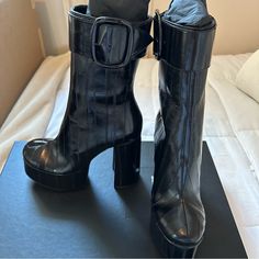 Beautiful Pair Of Saint Laurent Billy 85 Platform Booties. Black Pannelli Anguilla Leather. 5.25 Inch Heel On 2.25 Inch Platform (Equivalent To 3 Inch Heel). Slightly Below Mid-Calf With Inner Zipper And Buckle Closure On Top. Size 38.5. Brand New. Never Worn. Please See Photos For More Details. Contact Me With Any Questions You May Have. Cleaning Out My Overloaded Closet. Please Check Out My Other Listings. Designer Patent Leather Heeled Boots With Reinforced Heel, Sleek Black Calf Leather Platform Boots, Black Calf Leather Heels With Sculpted Heel, Designer Patent Leather Boots With Sculpted Heel, Luxury High Heel Patent Leather Boots, Luxury Patent Leather High Heeled Boots, Black High Heel Platform Boots For Evening, Black Calf Leather Heels With Square Toe, Luxury Platform Boots With Sculpted Heel