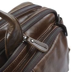 The Aztec is one of the most modern and versatile bags from Delton. The high-quality leather is tanned to a deep hazel brown gloss while retaining its natural, weathered look. The word "multifunctional" doesn't do this one justice. Wear it as a shoulder bag thanks to the sturdy, adjustable strap. To carry on your back, simply unzip and pull out the built-in straps. Finally, open the 2 side pockets, pull out the twin straps, and transport it by hand. This baby's the transformer of men's bags. The high-quality, durable buckles and heavy-duty metal zippers and clips ooze quality. But what about space? The main, sizable compartment accommodates your laptop and is loaded with extra pockets and storage options to separate all your items conveniently. This is a sturdy bag you can depend on throug About Space, Jewelry For Men, Men's Bags, Mens Leather Bag, Accessories Jewelry, High Quality Leather, Sling Backpack, Cow Leather, Leather Men