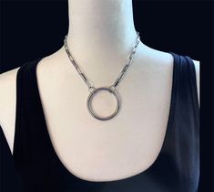 This stainless-steel O ring choker necklace makes a statement, Fashionable, Fun, and Adjustable. It features a chunky oval rectangle cable chain accented with a steel O ring with a stainless-steel lobster clasp All 3 pics show the same chain with the 3 different O Ring sizes O Ring is the clasp comes in 3 sizes  small - 1-1/4" medium - 1-12" large - 1-3/4 * Steel O Ring  * Stainless Steel Oval Rectangle Cable Chain 5x14mm * Stainless Steel lobster clasp Measure where you want the necklace to fall If you do not see your size message me, or put in notes Pick your size in drop down menu and o ring size This piece is handmade and comes to you in a gift box **Please note colors may vary with screen and monitors Please include Apartment numbers with your address, if needed for delivery. Your sat O Ring Choker, Necklace Gothic, Cable Chain Necklace, Wedding Jewellery Necklace, Ring Sizes, Wedding Necklace, O Ring, Cable Chain, Ring Necklace