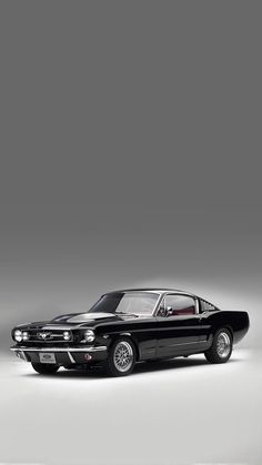 an old muscle car is shown in this black and white photo