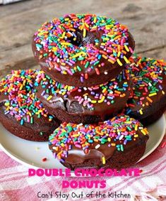 chocolate donuts with sprinkles on a plate