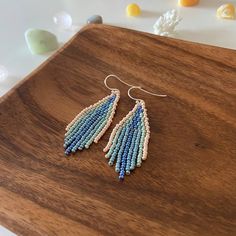 "These blue beaded fringe earrings are made of high quality Czech beads. They are lightweight and comfortable. These beaded earrings are an amazing gift for special occasions: holidays, birthdays, anniversaries, Christmas, Valentine's Days and more. It can also be jewelry for the bride or bridesmaids at a boho wedding. This pair is a mix of ethnicity and modern casual style. I create for women who love to feel completely different. Colors: blue, turquoise, beige.  -------------------------------------------- ✦ The Details: ✔ Made with quality Japanese beads ✔ Made using strong bead weaving thread.  ✔ Lenght: app. 2 inches ✔ Sterling silver earrings hooks There may be some color discrepancies which is due to the different monitor settings ✦ All  earrings hooks are nickel and lead free! ✦ Mo Bohemian Blue Earrings With Beaded Fringe, Bohemian Blue Beaded Fringe Earrings, Blue Bohemian Beaded Fringe Earrings, Blue Bohemian Beaded Fringe Tassel Earrings, Bohemian Blue Chandelier Earrings With Fringe, Blue Bohemian Chandelier Earrings With Fringe, Bohemian Blue Fringe Chandelier Earrings, Bohemian Macrame Tassel Dangle Earrings, Blue Fringe Beaded Earrings For Beach