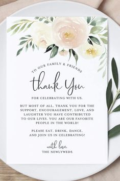 a thank card with flowers and greenery on it