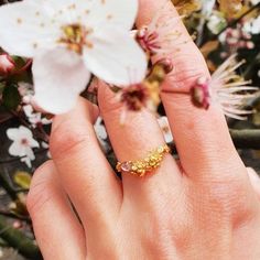 Cherry Blossom Diamond and Pink Tourmaline Ring - cherry blossom ring, sakura ring, flower ring, pink ring, dainty ring, delicate ring, pretty ring, floral ringThis beautiful cherry blossom ring is delicate and elegant. Ring features intricate cherry blossom flowers and buds, set with a soft pink tourmaline gemstone and a diamond, all nestled on a pretty cherry tree branch in a chevron shape.  Cherry blossoms are revered around the world for their overwhelming beauty, and their ephemeral, fleeti Dainty Blossom-colored Jewelry For Anniversary, Dainty Pink Flower Ring, Elegant Blossom-colored Rings For Gifts, Cherry Blossom Wedding Ring, Sakura Ring, Cherry Tree Branch, Cherry Blossom Ring, Floral Wedding Bands, Cottagecore Jewelry