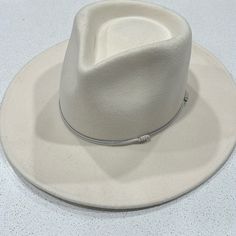 This Is A Beautiful Wool Rancher Hat! Never Worn But Tried On In The Store. Leather Hat Bands And Adjustable Fit! Cream Fedora Hat One Size Fits Most, Casual Cream Felt Hat For Winter, Casual Beige Felt Hat For Rodeo, Cream Brimmed Fedora One Size Fits Most, Casual Felt Hat For Spring Rodeo, White Casual Felt Hat For Winter, Casual Felt Hat For Rodeo In Spring, White Fedora For Winter Rodeo, White Winter Fedora For Rodeo