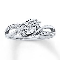 a white gold ring with diamonds on it