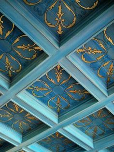 the ceiling is painted blue and gold