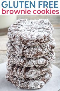 a stack of chocolate cookies with powdered sugar on top and the words gluten free brownie cookies above it