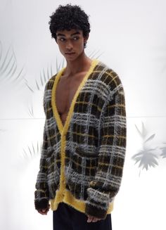 Elevate your style with the Mustard Plaid Mohair Cardigan. Featuring a deep V-neck, five-button closure, yellow seams, dropped shoulders, extended sleeves, and two front pockets, this oversized cardigan offers a cozy mohair knit feel. Available in sizes Small to Extra Large. Material: Mohair faux fur Color: Mustard Size Chart: SIZE (CM) LENGTH SHOULDER CHEST SLEEVE CUFFS SMALL 68 54 116 58 20 MEDIUM 70 56 120 59 21 LARGE 72 58 124 60 21 EXTRA LARGE 74 60 128 61 22 Yellow V-neck Outerwear For Winter, Yellow V-neck Winter Outerwear, Oversized Yellow Winter Cardigan, Oversized Yellow Cardigan For Winter, Yellow V-neck Cardigan For Layering, Patchwork Flannel, Mohair Knit, Mohair Cardigan, Oversized Cardigan