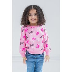 Your little girl is ready to play with her favorite dolls in this cute Barbie sweatshirt. This stylish pink pullover sweater features an all-over print of stars and the iconic Barbie logo and icon. Made of a soft material that keeps your little girl comfortable, this cozy Barbie sweatshirt is part of the perfect outfit for a fun day. BARBIE (R) and associated trademarks and trade dress are owned by, and used under license from, Mattel. (c) 2022 Mattel. Playful Pink Crew Neck Sweater, Playful Long Sleeve Sweatshirt With Character Print, Pink Character Print Top For Winter, Pink Character Print Tops For Winter, Winter Pink Tops With Character Print, Playful Pink Cotton Sweatshirt, Pink Crew Neck Top With Star Print, Cute Pink Sweater With Letter Print, Cute Pink Letter Print Sweater