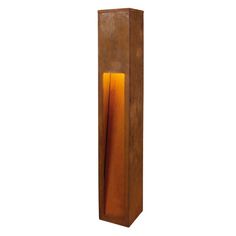 a tall wooden object with an orange light in it