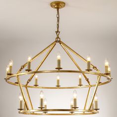 a golden chandelier with candles hanging from it's center circle, on a white background