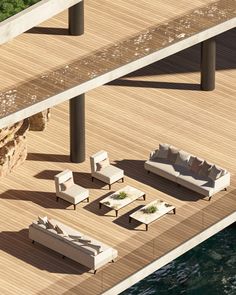 an aerial view of a living room with couches and chairs on a wooden deck