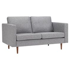 a gray couch with wooden legs on a white background